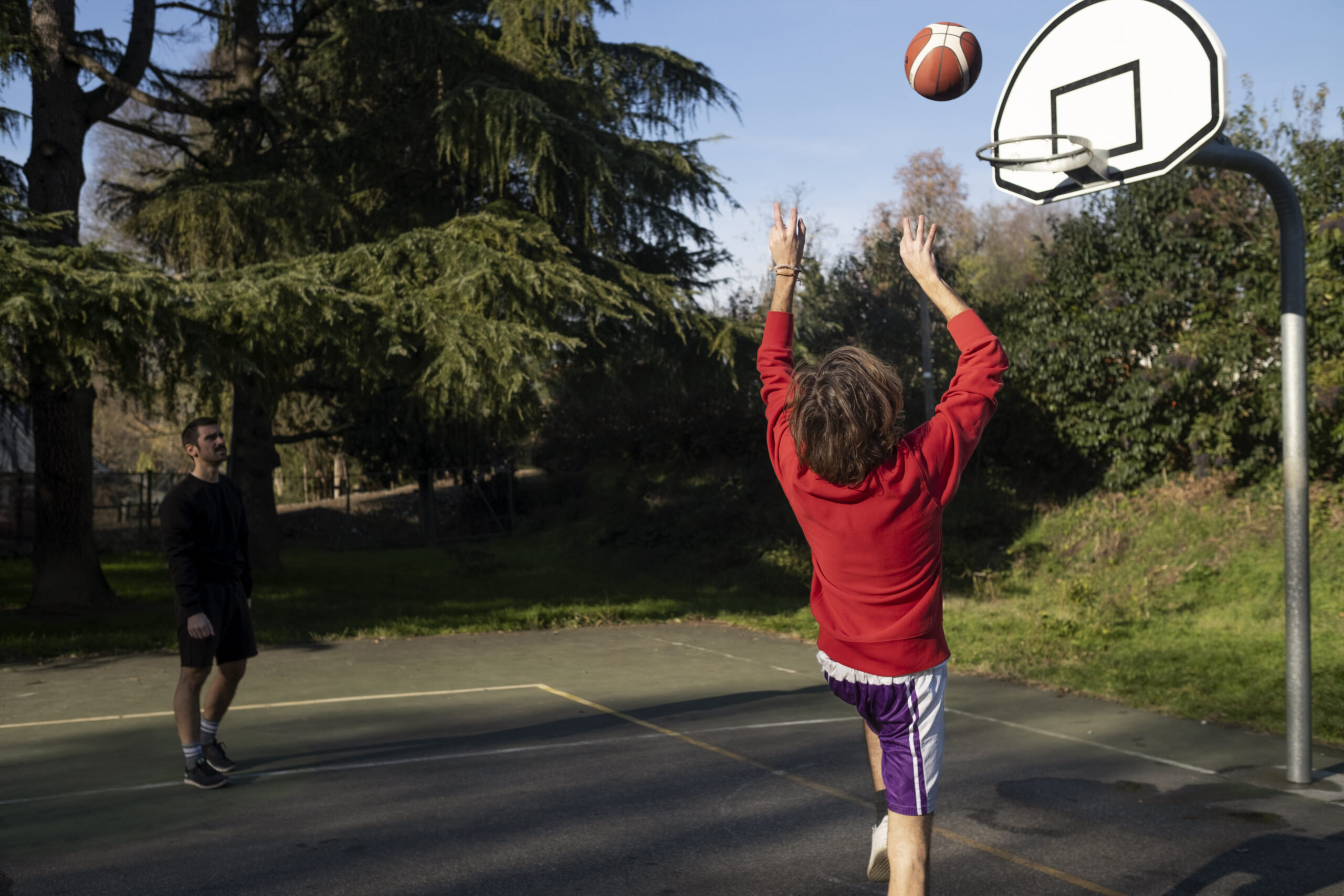 middle-age-friends-having-fun-together-playing-basketball (1)