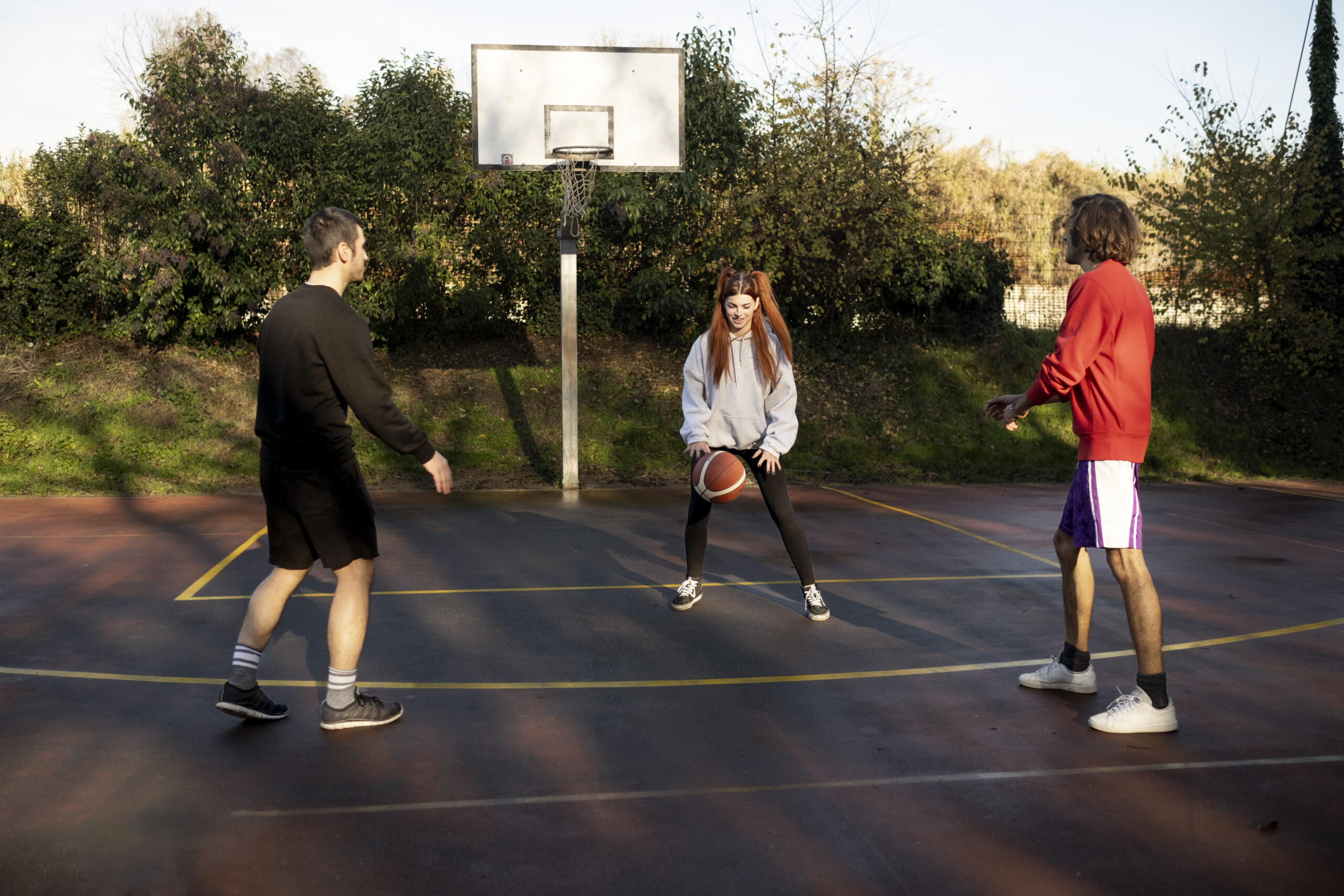 middle-age-friends-having-fun-together-playing-basketball